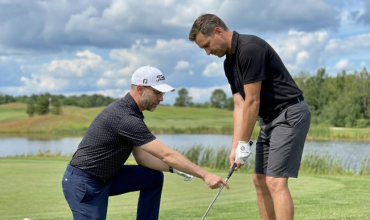 Ryan Rinneard coaching a student on the short game at Mad River Golf Club